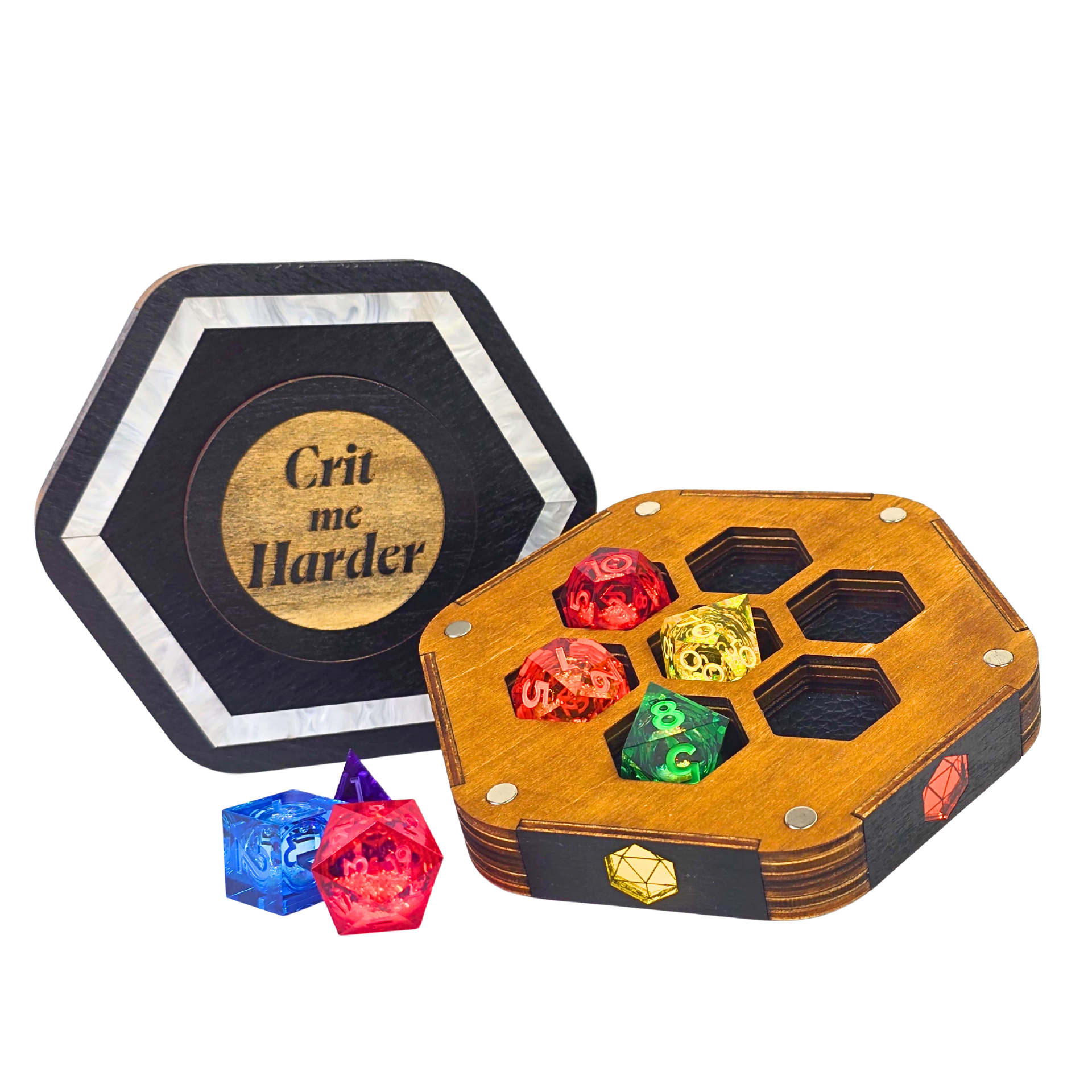 Jeweled Agenda Dice Vault lid engraved Crit me Harder with a pearlized ivory border, beside the open base holding 7 polyhedral dice in honeycomb pockets