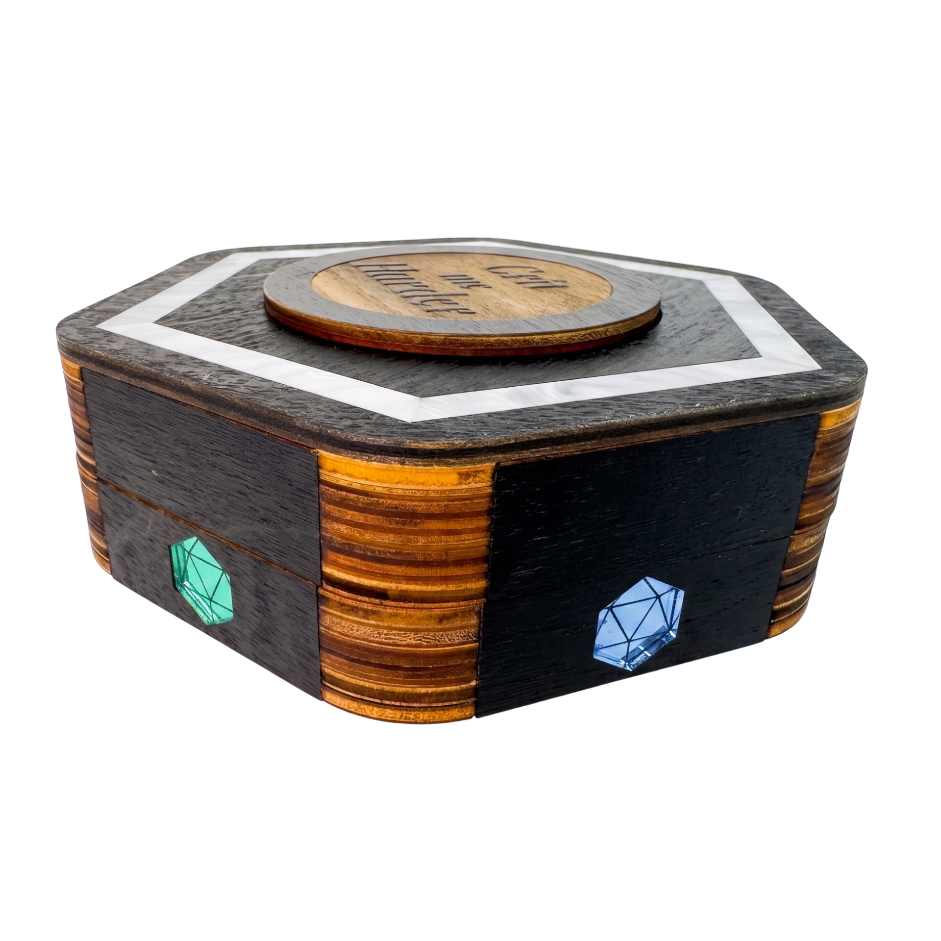 Closed Jeweled Agenda Dice Vault from above with black-stained hexagon lid, pearlized ivory acrylic border, Crit me Harder medallion, and D20 pride gems