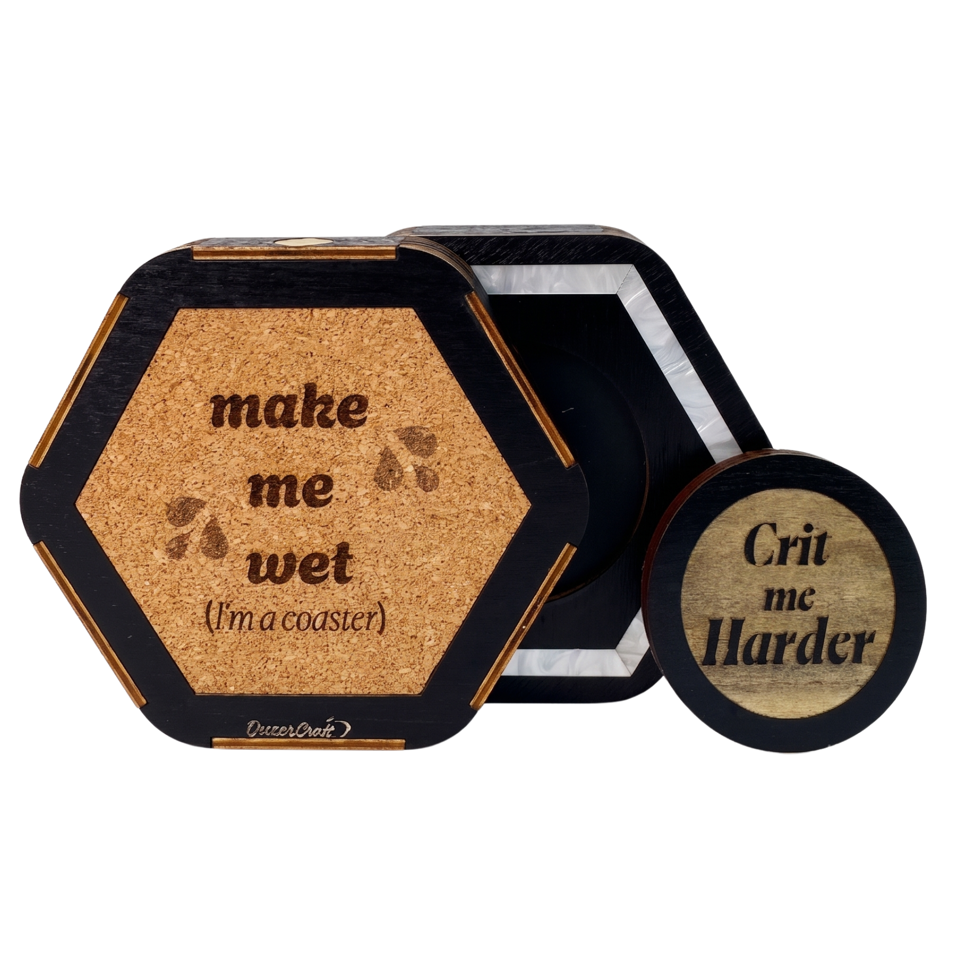 Detail of the Jeweled Agenda Dice Vault cork base engraved make me wet, I am a coaster, and the swappable Crit me Harder magnetic wood medallion