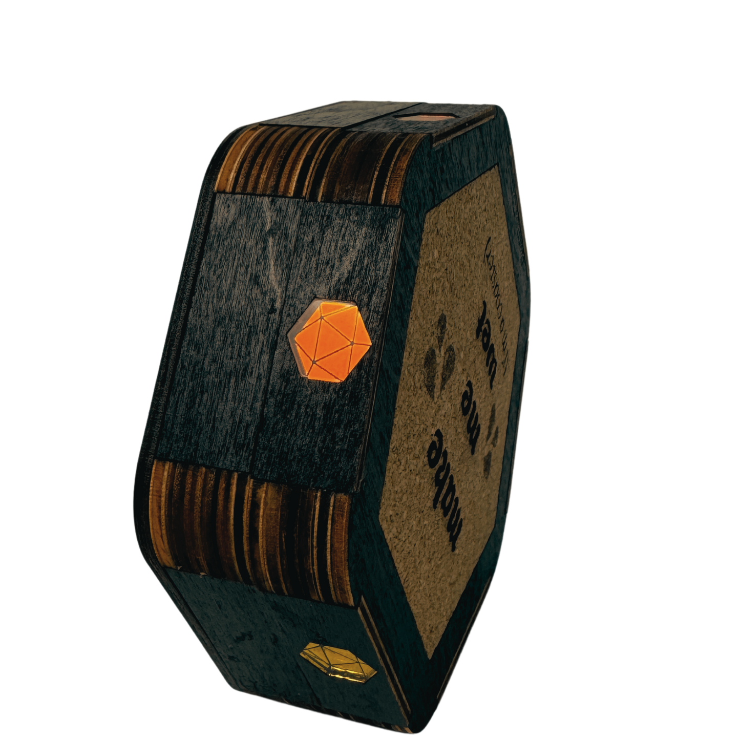 Jeweled Agenda Dice Vault standing on edge showing orange and gold mirrored D20 pride gems on the black birch body and the cork make me wet coaster base