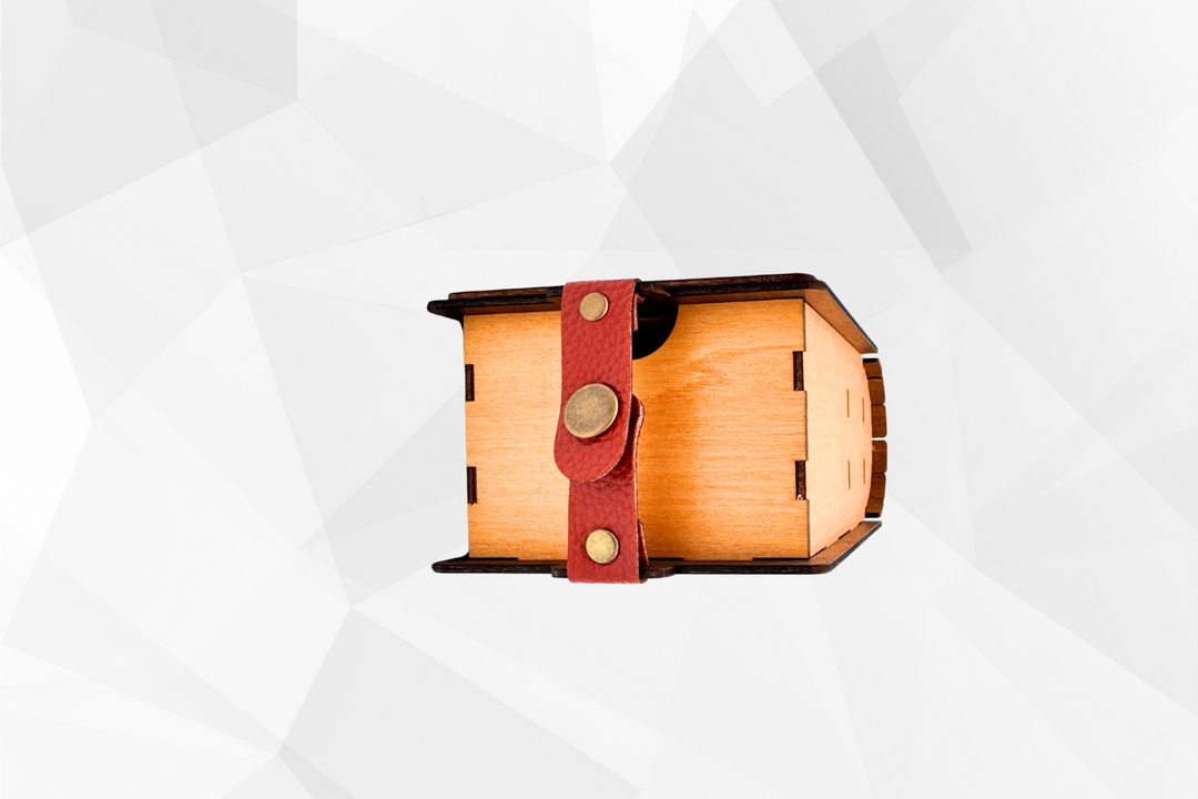 Wooden box with a red leather strap on a white background